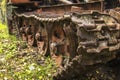 Background old rusty tractor abandoned in the woods