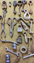 Background, old tools hanging like memorabilia on a wooden panel. many of them now out of use. Royalty Free Stock Photo