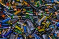 Background - old used discarded AA cells and other electric batteries