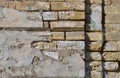 Background of old vintage dirty brick wall with peeling plaster, texture. Copyspace Royalty Free Stock Photo