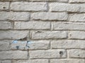 Background of old vintage dirty brick wall with peeling plaster, texture. Old multi colored brick wall Royalty Free Stock Photo