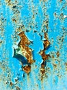 Background of an old wall covered in blue paint. Rusty metal surface. Old textured background Royalty Free Stock Photo