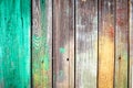Background of old wooden boards with nails, green and yellow paint stains on textured wood plank. Royalty Free Stock Photo