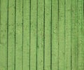 Background old wooden green fence with peeling paint. wooden texture with peeling paint Royalty Free Stock Photo