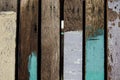 Background old wooden planks are painted with multicolored paint