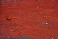 Background - old wooden surface painted boards. Close-up. The old red paint all cracked from time to time Royalty Free Stock Photo