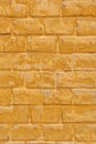 Brick and plaster yellow ochre background. Royalty Free Stock Photo