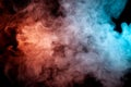 Background of orange, purple, red and blue wavy smoke on a black  ground. Abstract pattern of steam from vape of smoothly Royalty Free Stock Photo