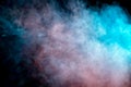 Background of orange, purple, red and blue wavy smoke on a black isolated ground. Abstract pattern of steam from vape of smoothly Royalty Free Stock Photo