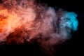 Background of orange, purple, red and blue wavy smoke on a black isolated ground. Abstract pattern of steam from vape of smoothly Royalty Free Stock Photo