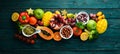 Background Organic food. Fruits, vegetables, beans and nuts on a blue background. Top view.