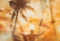 Background with palms and sunset on the beach and silhouette of the man Royalty Free Stock Photo