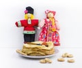 Background with pancakes, textile dolls, sushki, wooden spoon with caviar for Maslenitsa festival.