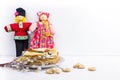 Background with pancakes, textile dolls, sushki, wooden spoon with caviar and pussy-willow for Maslenitsa festival.