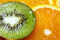 Background parts of orange and kiwi by rings. Royalty Free Stock Photo