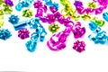 Background of Party Ribbons and Bows in Bright Colors on White