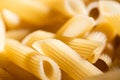 Background pasta is illuminated in closeup by bright sunlight. Royalty Free Stock Photo