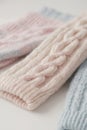 Background of pastel colored knitted wool featuring a cable knit stitch. Royalty Free Stock Photo