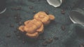 Background from pastries and coffee, fragrant fried grains on a silk surface, dough teddy bear, dessert, cappuccino with cookies