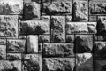 Background of pattern of decorative uneven stone wall surface in black and white Royalty Free Stock Photo