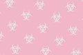 Background pattern of light gray biohazard symbols on pastel pink. Pandemic panic.