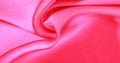 Background pattern texture wallpaper, crimson pink silk fabric. It has a smooth matte finish. Use this luxurious fabric for