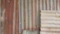 Background pattern of vintage wall made of zink roof with some rusted part Royalty Free Stock Photo