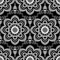 Background pattern with white mehndi seamless lace decoration items on black background.
