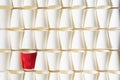Background pattern of white paper cups with red cup in the middle Royalty Free Stock Photo