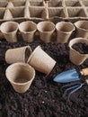 Background with peat pots and the ground. Spring planting work. Royalty Free Stock Photo