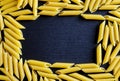 Background of Penne on a black stone background with copy spase Royalty Free Stock Photo