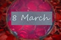 Background of petals of red roses And the inscription on March 8 Royalty Free Stock Photo