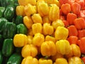 Green yellow and orange peppers