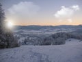 Background photo of low clouds in a mountain valley, vibrant blue and orange sky. Sunrise or sunset view of mountains and peaks Royalty Free Stock Photo