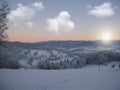 Background photo of low clouds in a mountain valley, vibrant blue and orange sky. Sunrise or sunset view of mountains and peaks Royalty Free Stock Photo