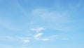 Background picture bright blue sky with thin white clouds