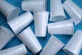 Texture white disposable glasses whole  a blue background Royalty Free Stock Photo