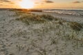 Background picture with senic sunset over a sand dune Royalty Free Stock Photo