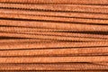 Background - pieces of rusty rebar piled in a heap close-up