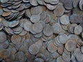 Texture of a pile of old silver coins in the ground Royalty Free Stock Photo