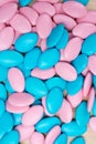 Background of pink and blue sugared almonds or chocolate