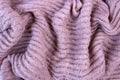 Background of pink crumpled woolen fabric