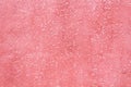 Background from pink textured plastered rough surface