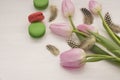 Background with pink tulips and macaroons.