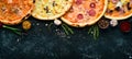 Background Pizza. Set of delicious pizzas with bacon, cheese and mushrooms. Royalty Free Stock Photo