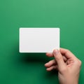 The background is a plain solid green providing contrast to the card Royalty Free Stock Photo