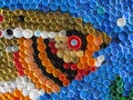 Background of plastic colorful bottle caps. Contamination with plastic waste. Environment and ecological balance. Art from junk. Royalty Free Stock Photo