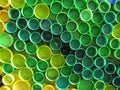 Background of plastic colorful bottle caps. Contamination with plastic waste. Environment and ecological balance. Art from junk. Royalty Free Stock Photo