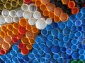 Background of plastic colorful bottle caps. Contamination with plastic waste. Environment and ecological balance. Art from junk. Royalty Free Stock Photo