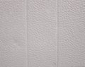 Background. Plastic white wall panels with a textured pattern. Panels for facing the bathroom or kitchen. Close-up of Royalty Free Stock Photo